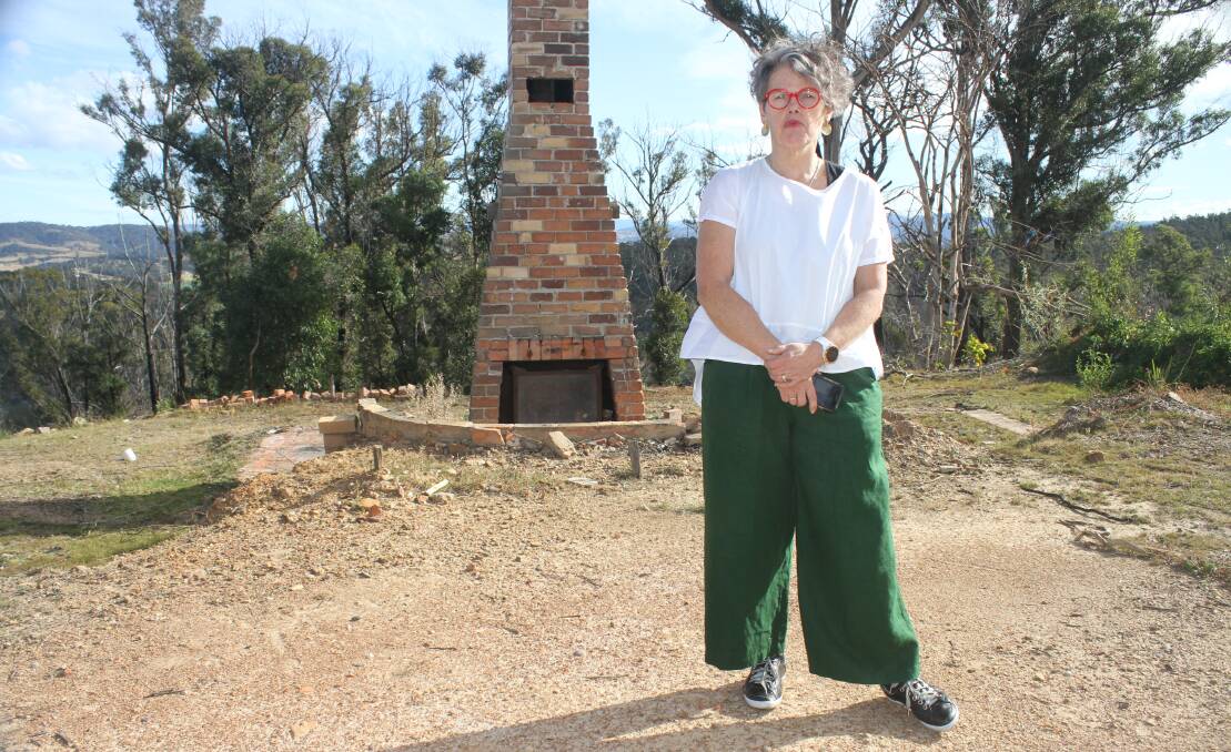Jan Harris stands where her living room once stood, two years after her family home was destroyed by fire. Picture: Alasdair McDonald