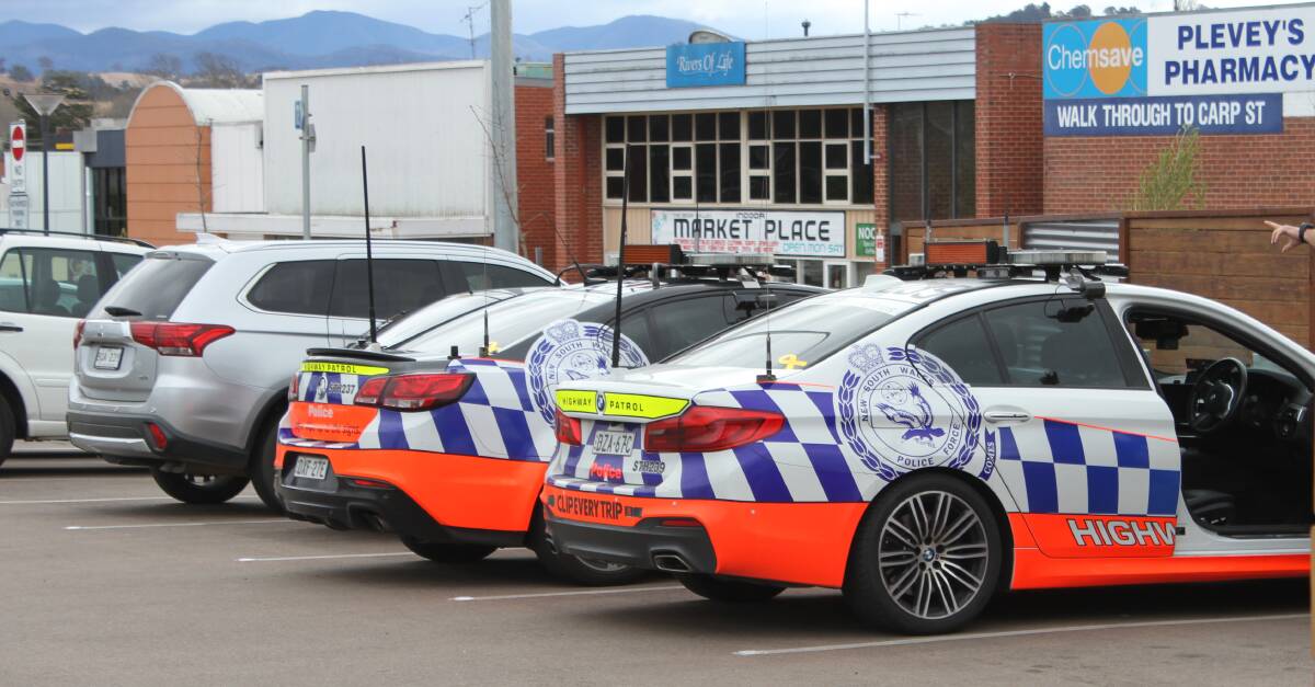 Two NSW Police Force Traffic and Highway Patrol Command in the car park area on Monday morning.