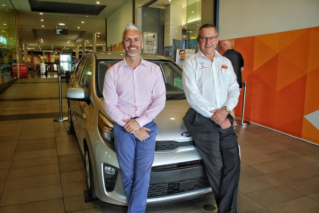 WIN A CAR: Bega Chamber of Commerce president Dave Mitchell with BDN sales manager Tim Shinnick encourage shopping locally this Christmas. Picture: Alasdair McDonald