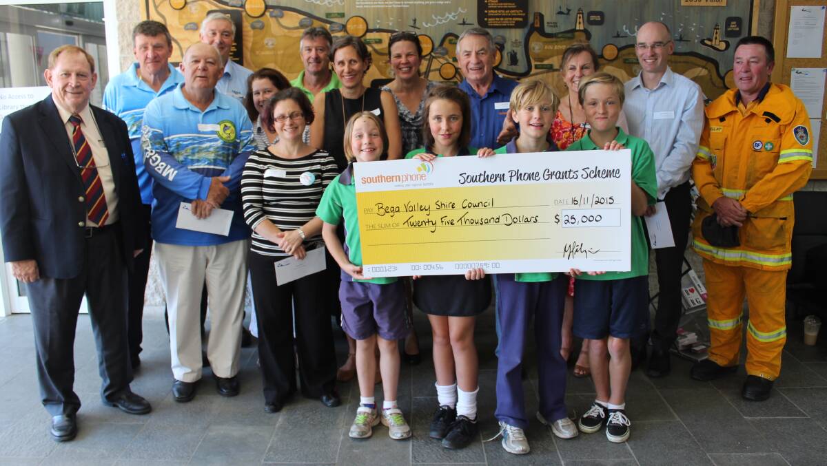 GRANTED: Recipients of the first round of the Southern Phone Grants Scheme for 2015 with mayor Michael Britten and Southern Phone chairman Bill Hilzinger. Holding the cheque are Bega Valley Public School pupils Georgie, Heidi, Caiden and Jude Butchers.