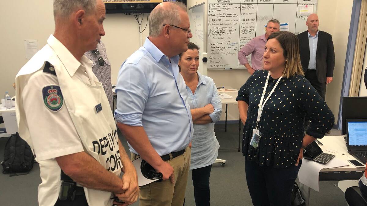 Former Bega Valley mayor Kristy McBain speaks with Prime Minister Scott Morrison and his wife Jenny during the height of this summer's bushfire emergency. Picture: BVSC