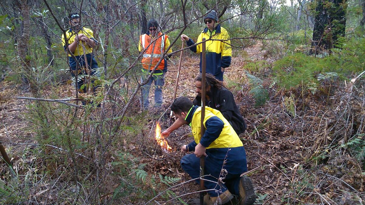Members of the Bega Local Aboriginal Land Council cultural burn crew and Dan Morgan
from South East Local Land Services assess the Tura Beach in preparation for cool burning. Picture: Supplied