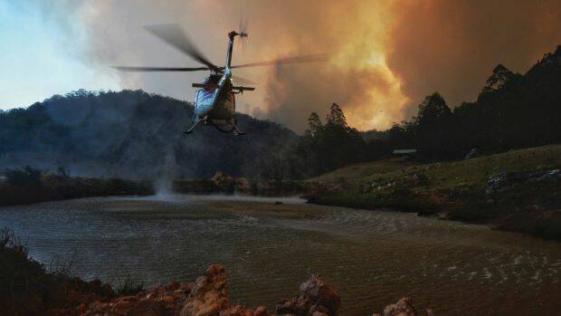 Environment Minister Matt Kean said some of the $22.9 million will be invested in aerial rapid-response firefighting teams. Photo: Nick Moir