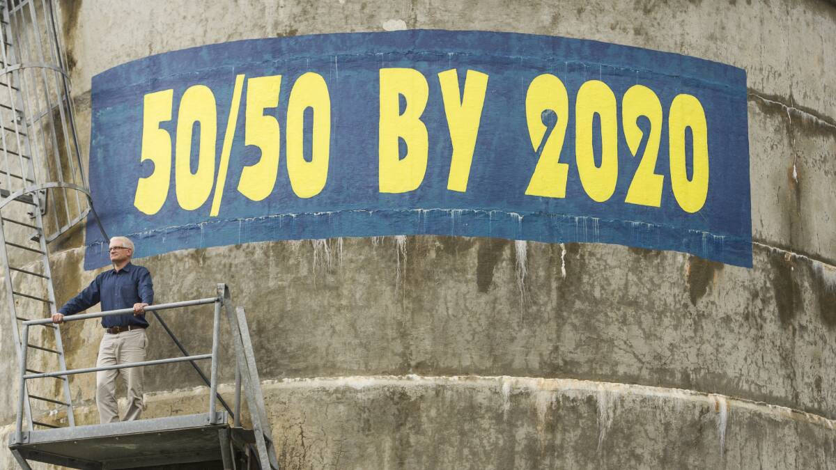 CEFE president Matthew Nott stands next to the sign he hopes will be updated to 100 per cent by 2030. Picture: Jay Cronan