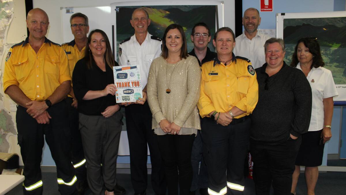 NSW RFS members Gary Cooper, Iain Stroud, John Cullen, Tamsyne Harlen, Marty Webster and Fiona Campbell with East Coast Radio's Jane Edwards, Tim Bergh and Kimmi Saker and Bega Valley Shire mayor Kristy McBain.
