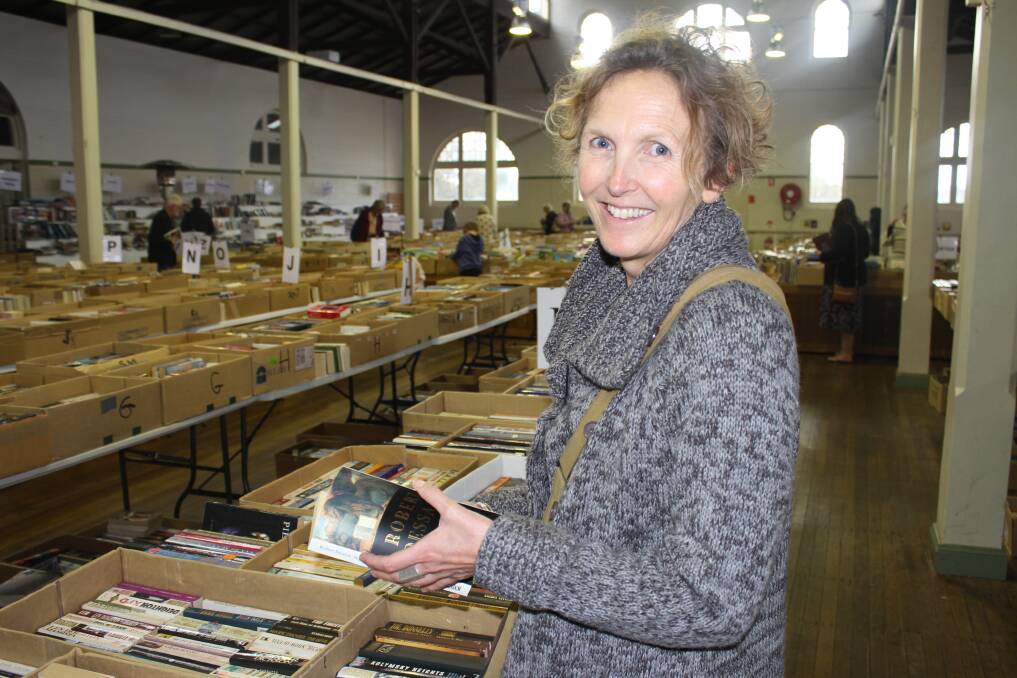 SEARCHING: Tathra's Jani Klotz was on the search for books to replace the ones lost during last year's tragic bushfire. Picture: Alasdair McDonald