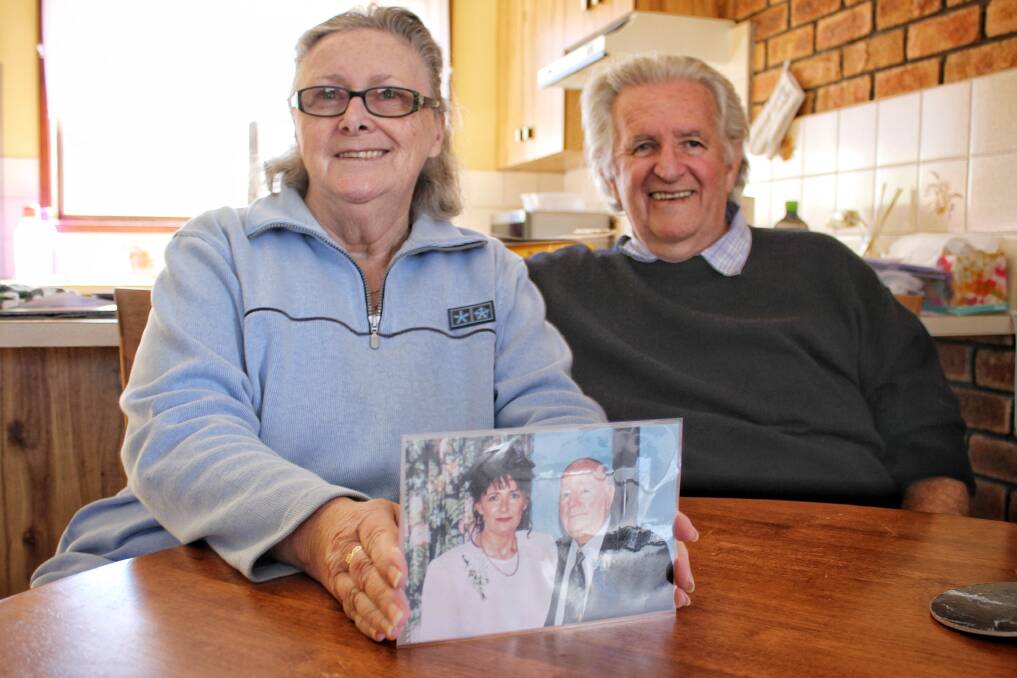 GOLDEN DISCOVERY: Tathra's Kath and Don Tetley in their new home with one of the photographs discovered in Kevin Tetley's collection. Picture: Alasdair McDonald