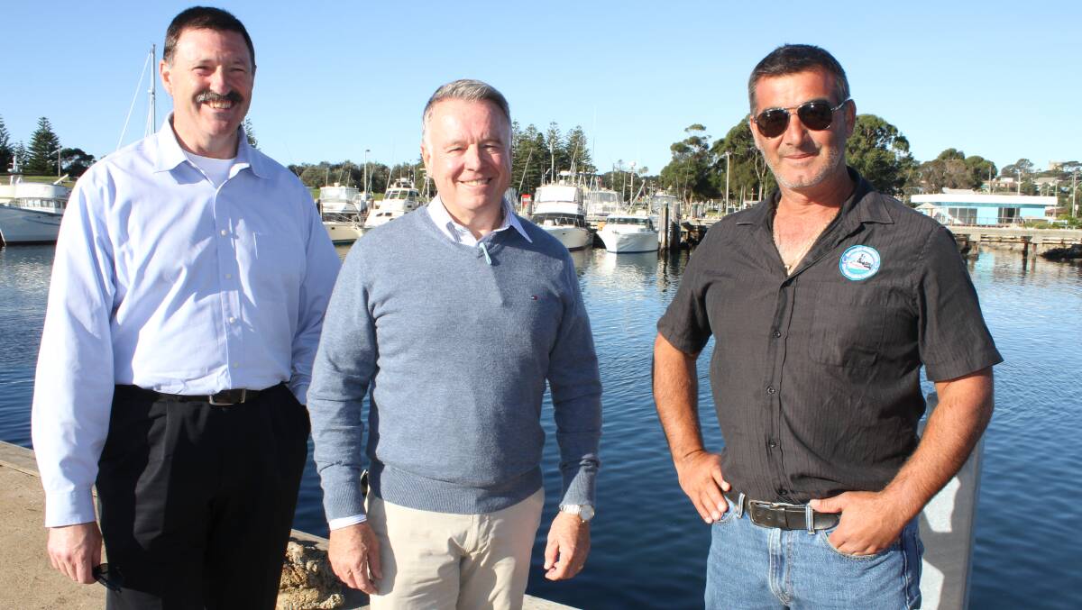 Eden-Monaro MP Mike Kelly with Hunter MP and Shadow Minister for Agriculture Joel Fitzgibbon and Bermagui Fishing Co-op chair Rocky Lagano in Bermagui this week.. Picture: Alasdair McDonald