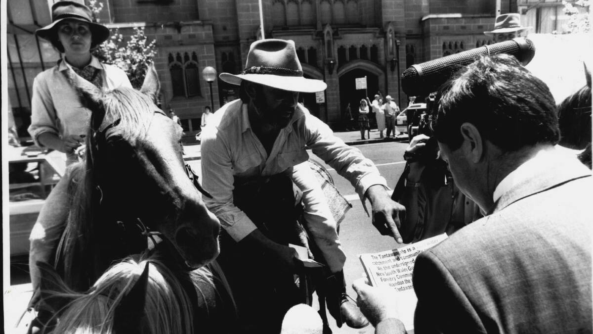 Councillor Roland Breckwoldt, on horseback, talks to a Liberal Party backbencher about native forest logging in Tantawangalo on November 30, 1989. Picture: Antonin Cermak