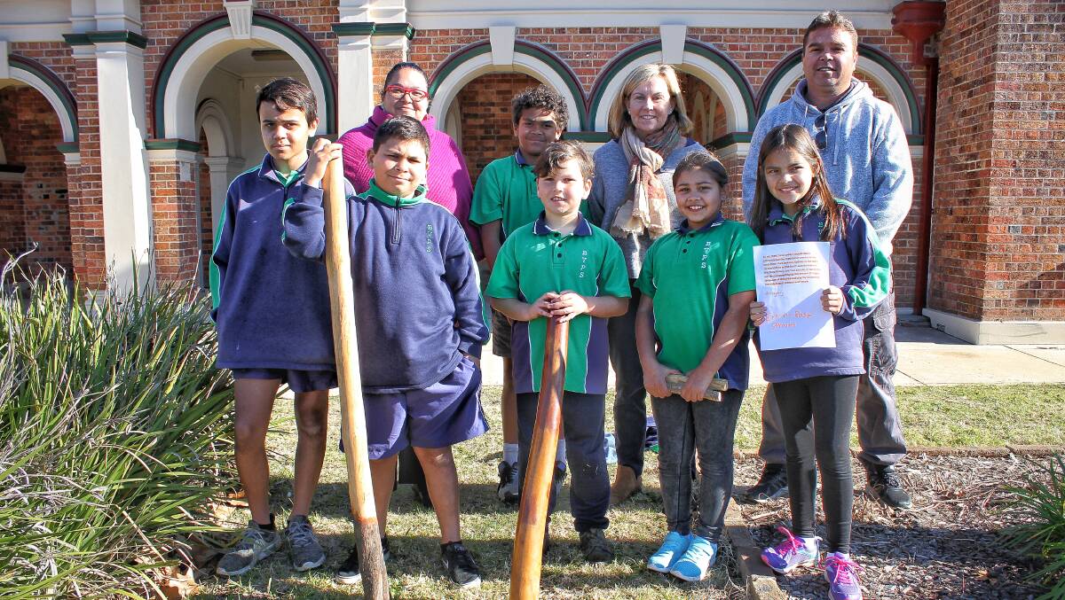 PRIDE: Pupils Kai Luff, Anton Pittman, Sam Andy, Tyrell Stewart, Shaylah Thomas and Emma Sproates with Bega Valley Public School's Michell and James Scott and principal Carolyn Nugent.