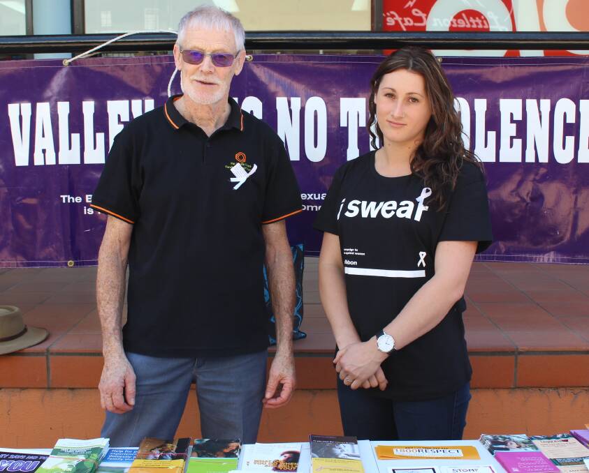 Say no: Geoff Bevitt of Far South Coast Family Support Services and Tahnee Austin of South East Women and Children's Services chat in Ayres Walkway on Wednesday for White Ribbon Day. Picture: Alasdair McDonald