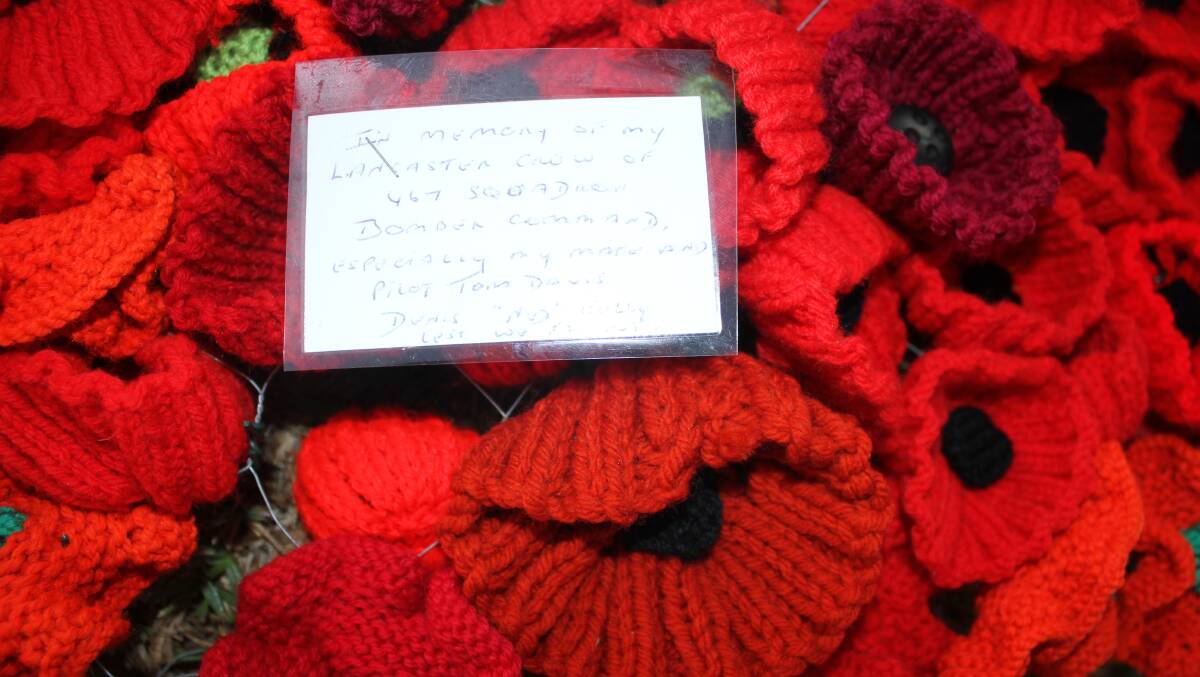 REFLECTING: A message left to lost friends at Tathra on Anzac Day 2016.