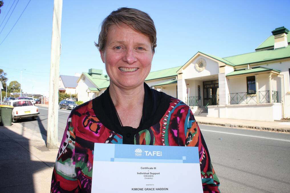 NEVER GIVE UP: Tarraganda's Kimone Haddon is all smiles with her Certificate 3 in Individual Support from Bega’s TAFE Campus. Picture: Alasdair McDonald