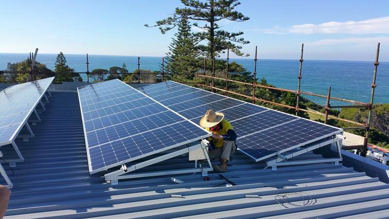 GETTING PREPARED: Solar panels being installed on the roof of the Tathra Hotel last week. Picture: Facebook
