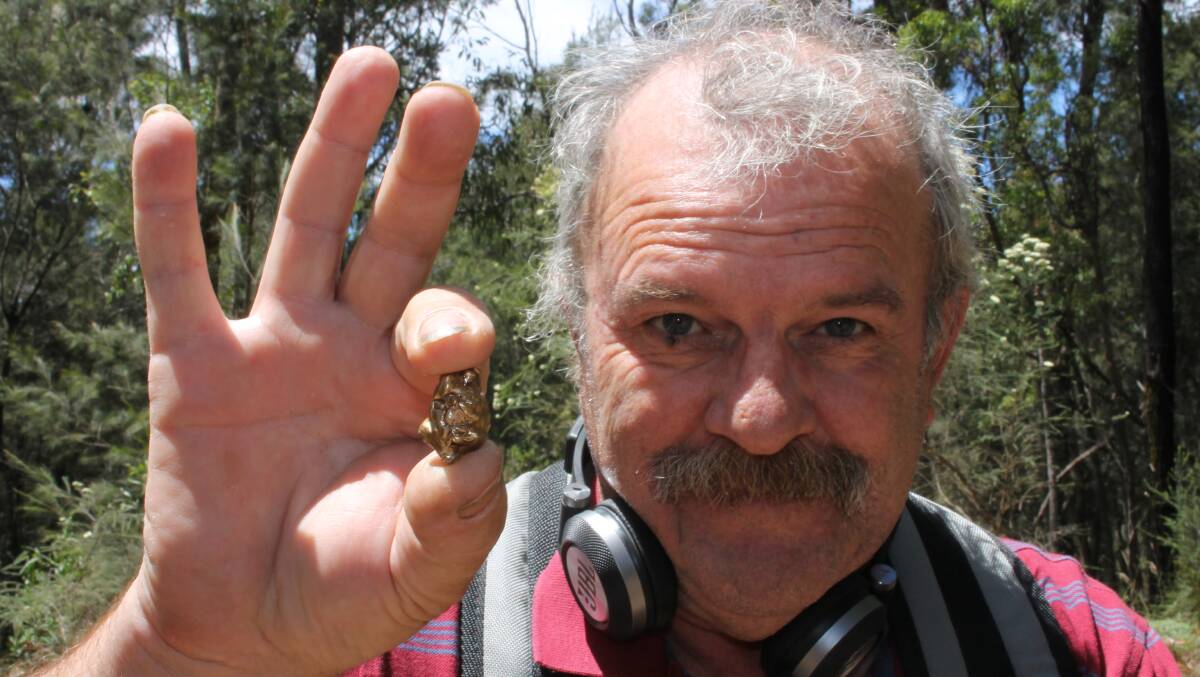 GOLDEN: Tathra's Doug Spindler, holding a piece of pretend gold, will be one of the happy fossickers after council's decision earlier this year.