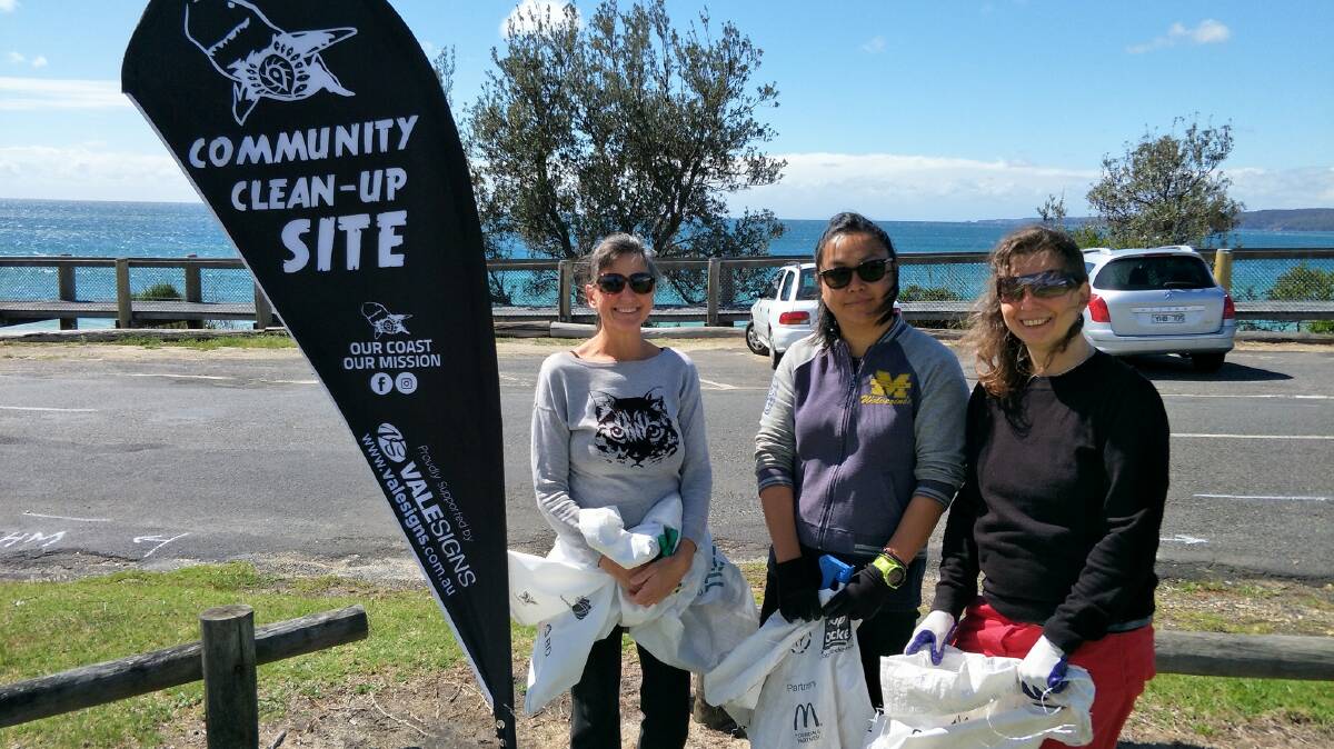 GRAB A BAG: Cleaners take to Eden's Aslings Beach as part of the Our Coast Our Mission campaign to clean up Australia's eastern beaches. Photo: East Coast Spring Clean 2017.