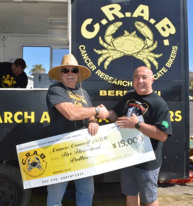 Cancer Research Advocate Bikers' Jim Gilchrist presents Grant Plecas of the Cancer Council a cheque for $15,000 raised by the group through recent fundraising.