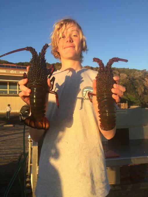 Sam Dixon aged 16 from Merimbula with a pair of lovely crayfish taken while skin diving off Merimbula.