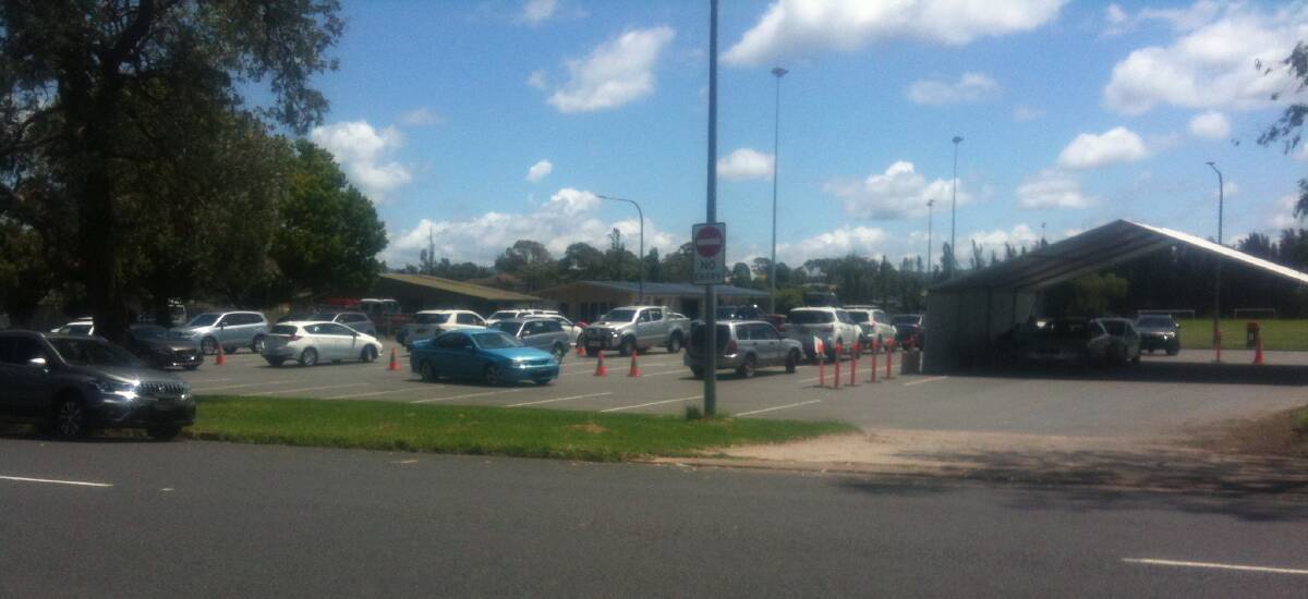 There were about 25 cars at one time waiting for COVID-19 tests at Gundary Oval Moruya on Monday with some cars being turned away.