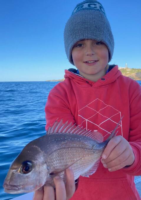 Mystery Bay's young Cody Eddy with a nice squire snapper he caught out from Montague Island last week, before the COVID-19 lockdown started.
