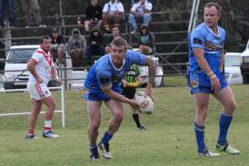 RUGBY LEAGUE: Blake Robinson passes the ball during Sunday's exciting game against Eden at Eden where the Heelers won 34 to 16 after a slow start.