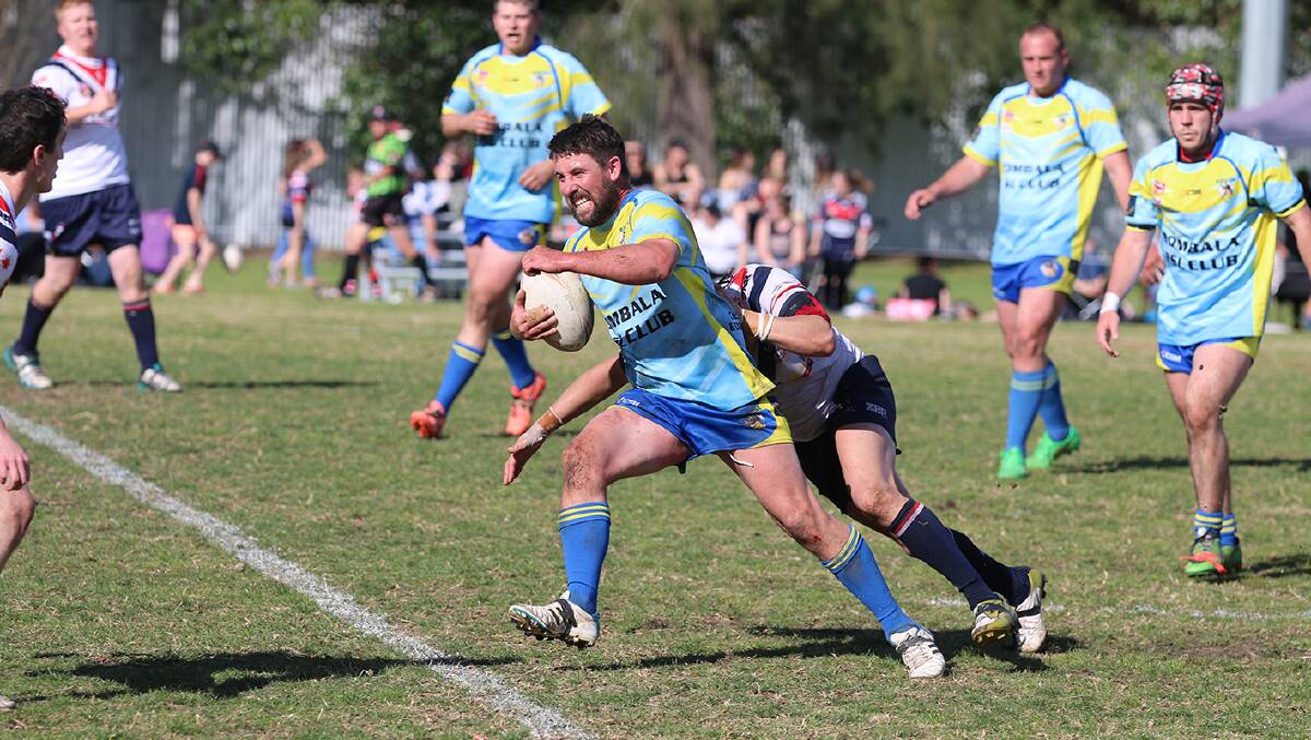 2016 RESERVES: Bombala Blue Heeler reserve, James Coates takes possession from the Bega Roosters during Sunday's grand final.