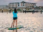 Paddleboarding is just one of the many activities enjoyed around Shellharbour. Picture supplied by Tourism Shellharbour.