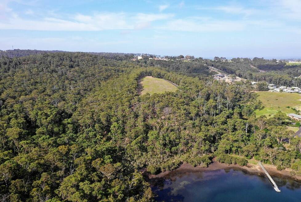 A large section of the parcel completely surrounded by bush has been previously opened up for a house site and has the best view of Merimbula Lake available from the property. Photo supplied.