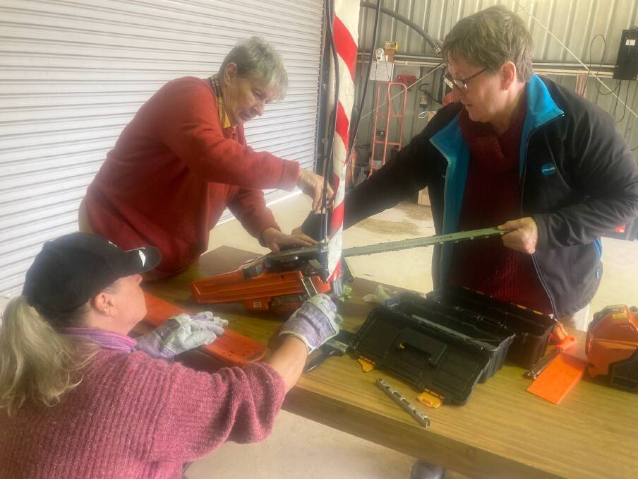 Sue Hinson, Janet Rees and Rose Manhire getting to know their tools. Photo supplied.