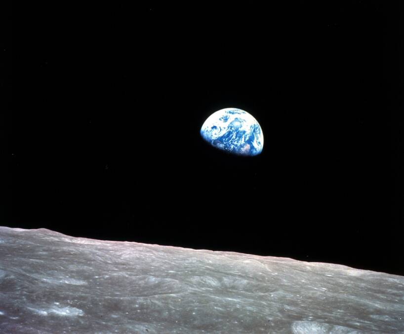 The Earth behind the surface of the moon during the Apollo 8 mission. Picture: William Anders/NASA via AP