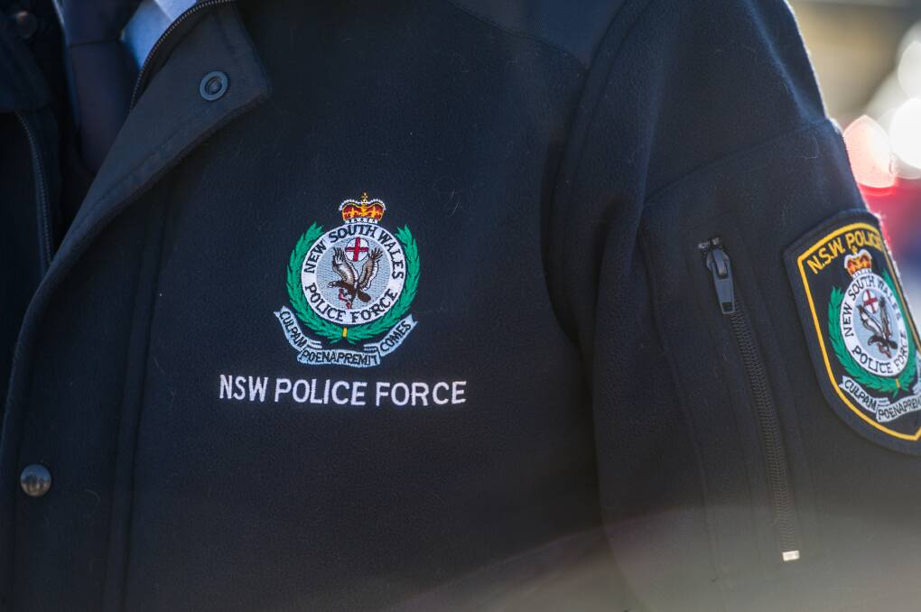 Police have charged a former Narooma school counsellor with physical assault of two girls.