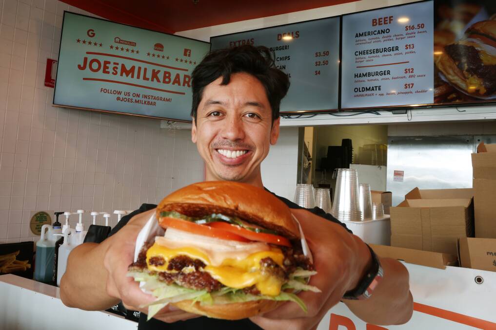 Joe's Milkbar owner Joseph Lee is proud of his burgers - and rightly so. Picture by Sylvia Liber.