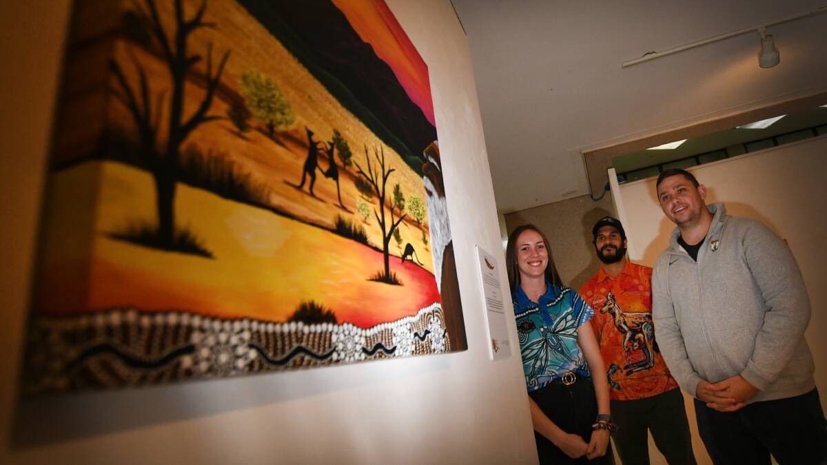 UNIQUE PERSPECTIVES: Paris Knox, Bradley Flanders and Marc Sutherland at the Bumbira art exhibition for a special NAIDOC celebration in Tamworth. Photo: Gareth Gardner