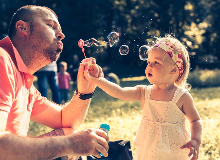 Don't forget to enjoy the simple things with your children. Photo: Shutterstock