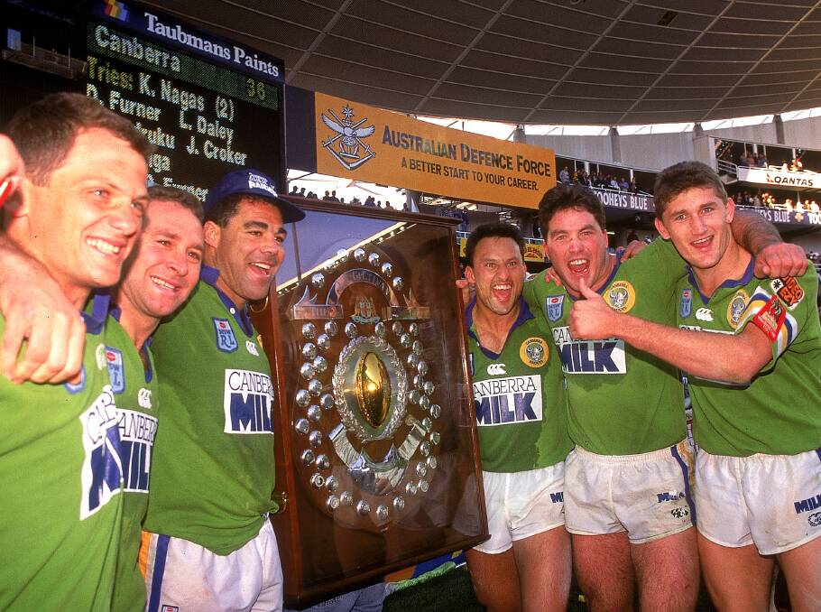 LOOKING BACK: Before the Super League war kicked off in 1995, the Canberra Raider revel in their 1994 ARL Grand Final win against the Canterbury Bulldogs in Sydney. (From left) are Steve Walters, Ricky Stuart, Mal Meninga, Laurie Daley, Bradley Clyde and Brett Mullins. Photo: Getty Images