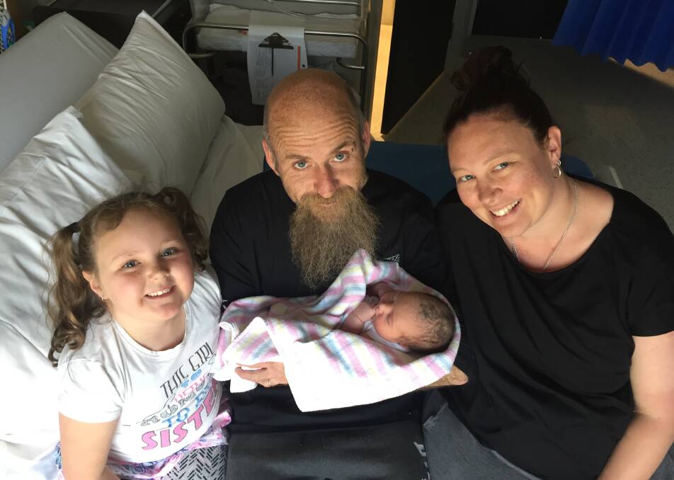 It's a girl: Shane and Heidi Bosch with their second daughter Harley May and proud big sister Rachel. Harley was born on September 20, weighing 7lb 12oz. 