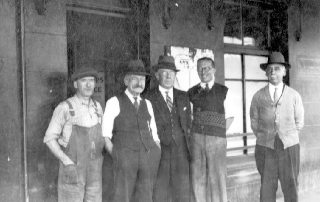 New service: Editor of the Southern Star, W.A. Smith (centre), was one of the first to have a telephone in Bega. The telephone exchange opened for business in 1906.