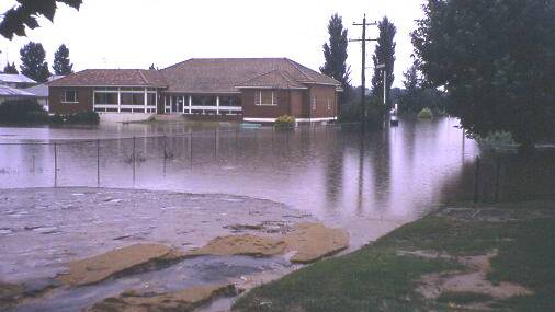 Damage widespread: The Bega Bowling Club surrounded by 1971 floodwaters. The flood has gone down in history as the highest recorded in Bega.