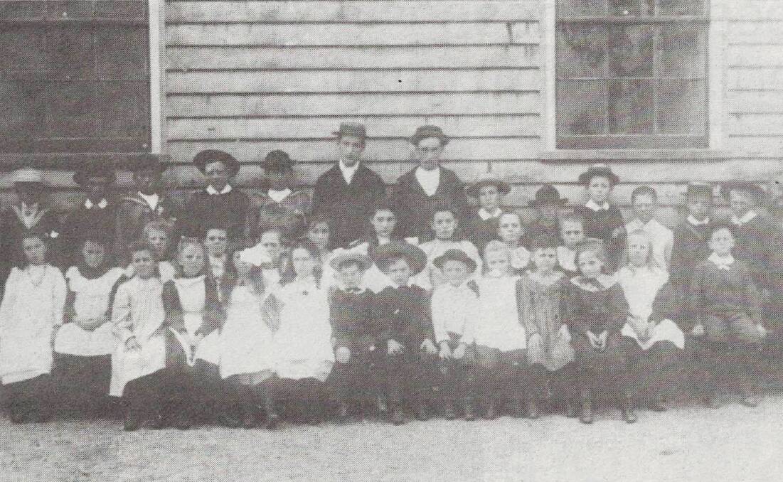 Early education: Tanja schoolchildren in 1890. Children who misbehaved or "were not so bright" often faced the cane.