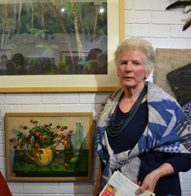 WINNER: Janet Jones and her painting "Autumn Rosehips" won the 2019 River of Art Festival art prize.