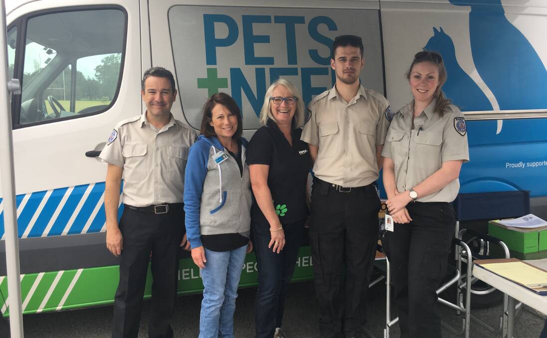 PET FRIENDLY: John Gomez, Louise Webb, Christine Allen, Mitchell Stirling and Kelly-Ann Marshall at last year's free microchipping day in Moruya. 
