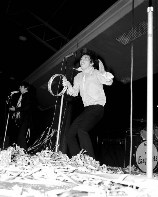 Stevie Wright (top) whamming his tambourine during an Easybeats performance in 1967.