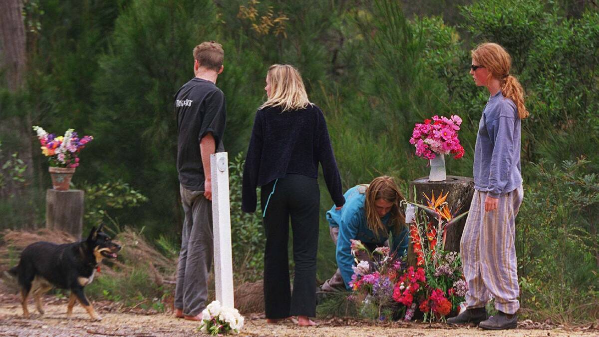Children lay flowers on the site of the abduction.
