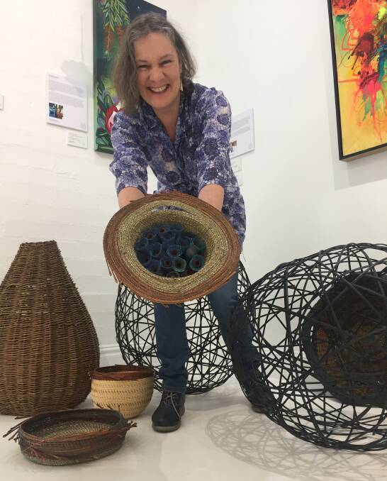 Resident artist Lissa De Sailles with some of her work at Fern Street Gallery in Gerringong.