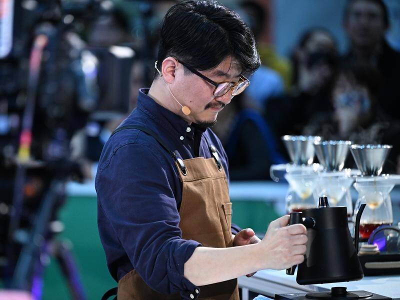 Harry Ko of Australia competes during the 2022 world barista and brewing championships in Melbourne. (James Ross/AAP PHOTOS)