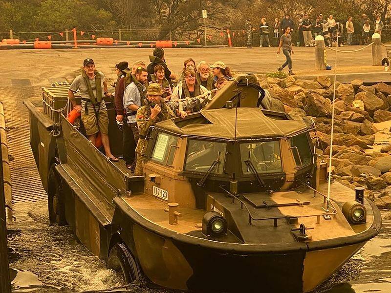 Navy vessels have evacuated about 1200 people and their pets from the Victorian town of Mallacoota.