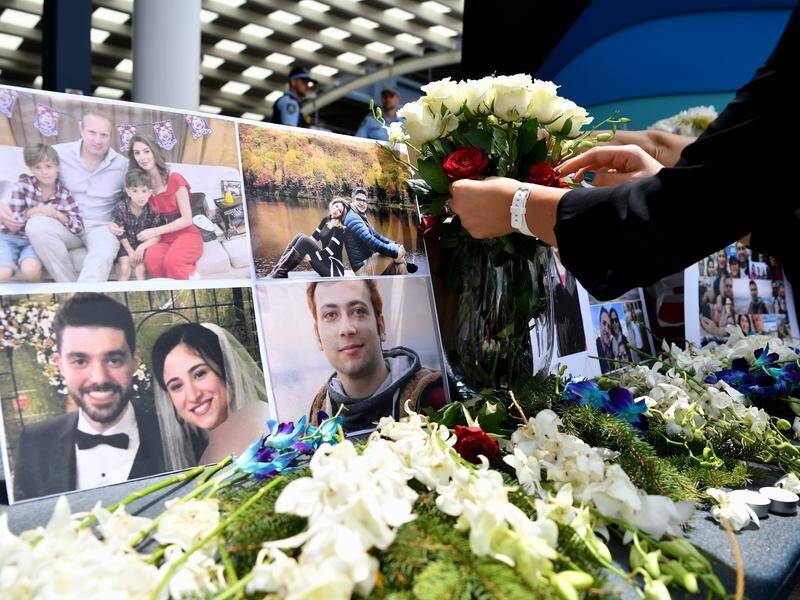 About 100 people gathered Sydney to pay their respects to the victims of the Iranian plane disaster.