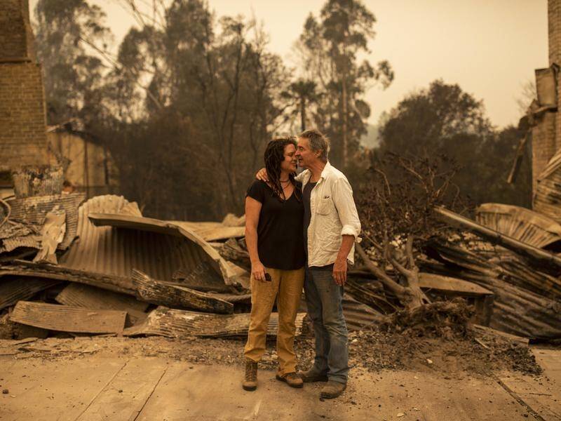 Sally Wilson (L) and her partner saved their home but lost their shop in Cobargo to embers.