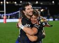 Warriors players Josh Curran (l) and Reece Walsh show their relief and joy after beating Bulldogs. (Andrew Cornaga/AAP PHOTOS)