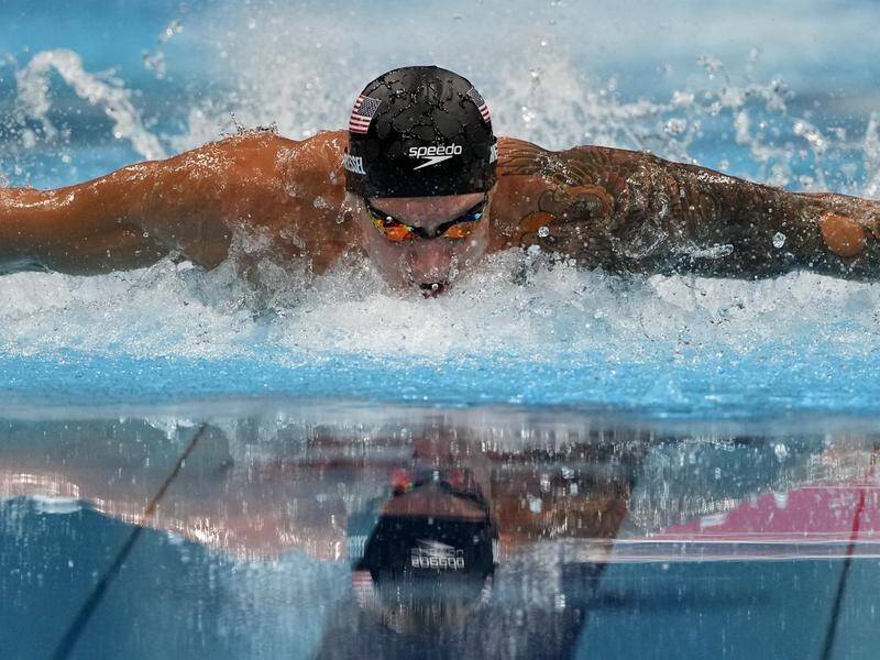 Caeleb Dressel has posted a world record in winning the 100m men's butterfly gold medal in Tokyo.